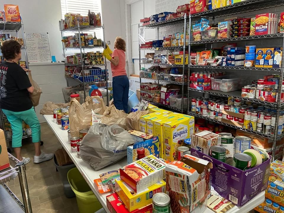 Volunteers packing food boxes